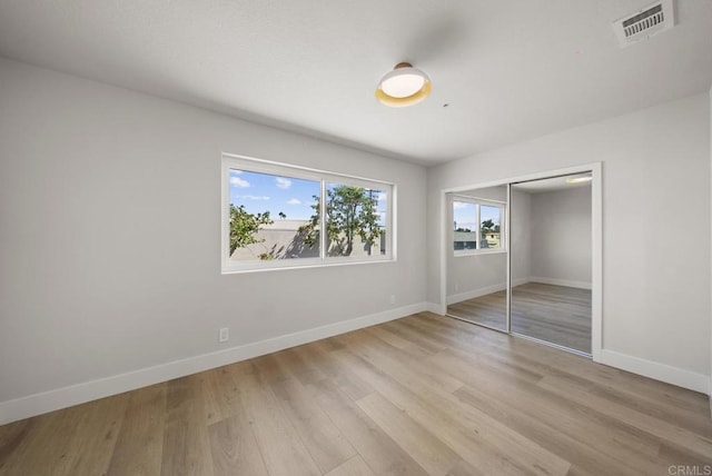 330 8th St, Seal Beach, CA 90740 - unfurnished bedroom featuring baseboards, light wood-style flooring, and a closet
