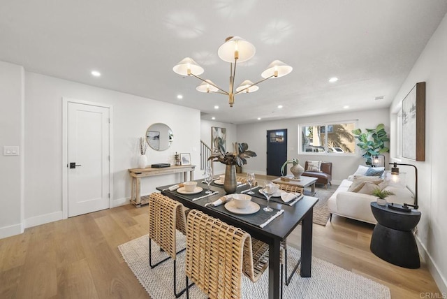 330 8th St, Seal Beach, CA 90740 - dining area with a chandelier, recessed lighting, light wood-style flooring, and baseboards