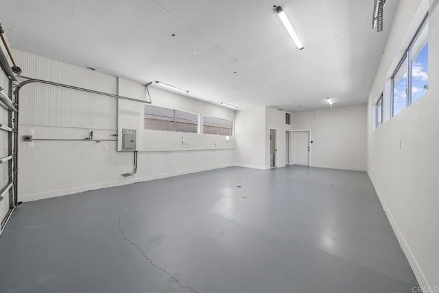 330 8th St, Seal Beach, CA 90740 - garage with baseboards and electric panel