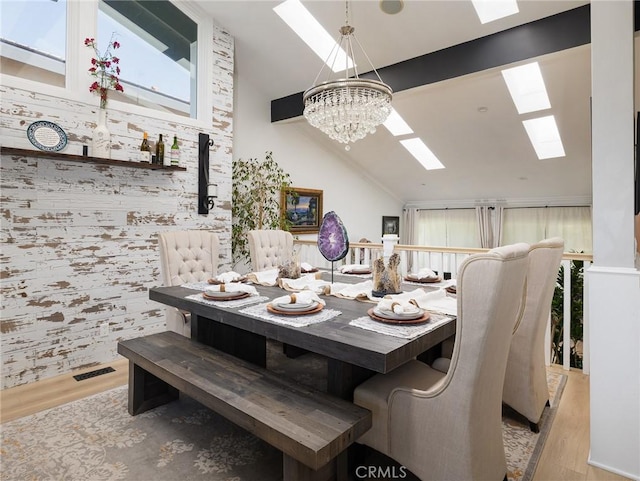 3504 Hightide Dr, Rancho Palos Verdes, CA 90275 - dining area with a skylight, wood finished floors, a chandelier, and high vaulted ceiling