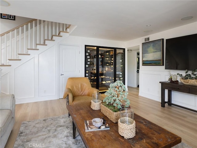 3504 Hightide Dr, Rancho Palos Verdes, CA 90275 - living room featuring light wood finished floors, stairway, and bar area