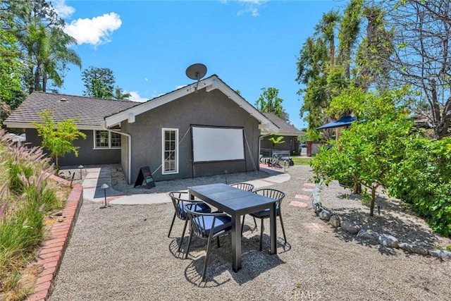 1821 Overview Cir, North Tustin, CA 92705 - back of property with stucco siding, a patio, and outdoor dining area
