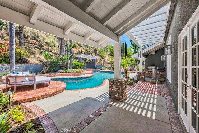 1821 Overview Cir, North Tustin, CA 92705 - view of pool featuring a patio, an outdoor kitchen, french doors, and a pergola