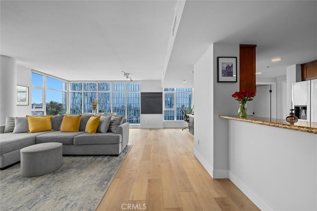 400 W Ocean Blvd Unit 605, Long Beach, CA 90802 - living room featuring light wood-style flooring and baseboards