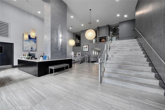400 W Ocean Blvd Unit 605, Long Beach, CA 90802 - welcome area with stairs, a high ceiling, and recessed lighting
