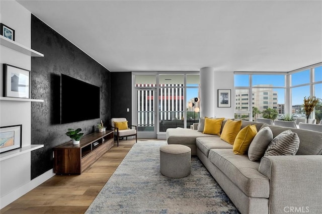 400 W Ocean Blvd Unit 605, Long Beach, CA 90802 - living room featuring wood finished floors, baseboards, and a wall of windows