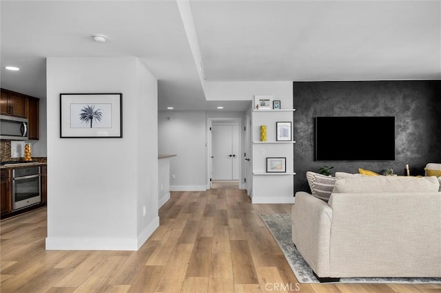 400 W Ocean Blvd Unit 605, Long Beach, CA 90802 - living room with light wood-style flooring, recessed lighting, and baseboards