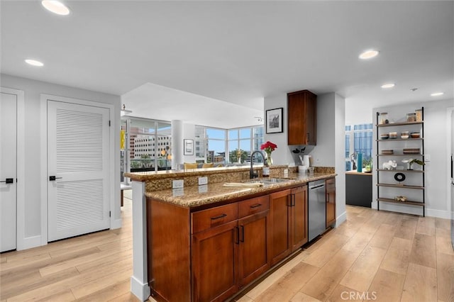 400 W Ocean Blvd Unit 605, Long Beach, CA 90802 - kitchen with dishwasher, light wood-style flooring, a sink, stone countertops, and a peninsula