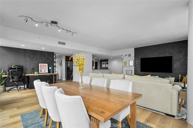 400 W Ocean Blvd Unit 605, Long Beach, CA 90802 - dining room with light wood-style flooring, an accent wall, a desk, and recessed lighting