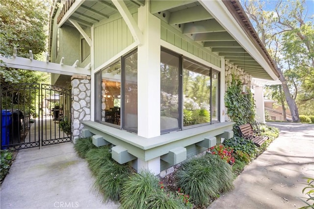 10139 Sun Valley Dr, Rancho Cucamonga, CA 91737 - view of side of home featuring a gate and stone siding