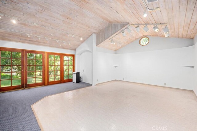 10139 Sun Valley Dr, Rancho Cucamonga, CA 91737 - unfurnished living room featuring rail lighting, wooden ceiling, vaulted ceiling, carpet floors, and french doors