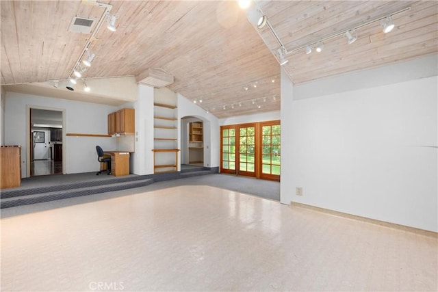10139 Sun Valley Dr, Rancho Cucamonga, CA 91737 - unfurnished living room with track lighting, wood ceiling, vaulted ceiling, arched walkways, and baseboards