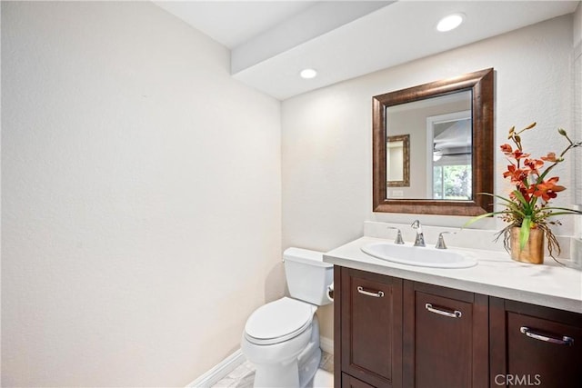 10139 Sun Valley Dr, Rancho Cucamonga, CA 91737 - half bathroom featuring vanity, toilet, baseboards, and recessed lighting