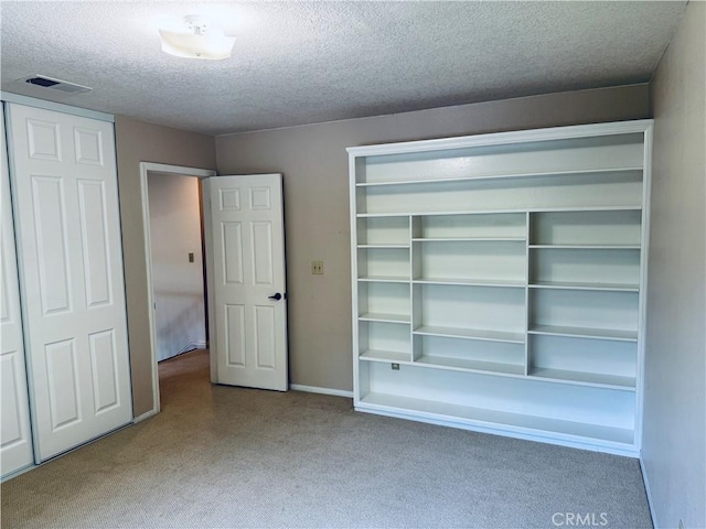 10139 Sun Valley Dr, Rancho Cucamonga, CA 91737 - unfurnished bedroom featuring a textured ceiling, carpet floors, a closet, and baseboards