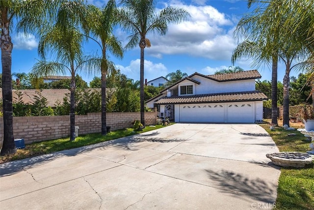 1250 Kinglake Dr, Diamond Bar, CA 91789 - view of front of property featuring concrete driveway, a tile roof, stucco siding, and a garage