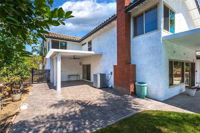 1250 Kinglake Dr, Diamond Bar, CA 91789 - back of property with stucco siding, ceiling fan, a patio area, and a chimney