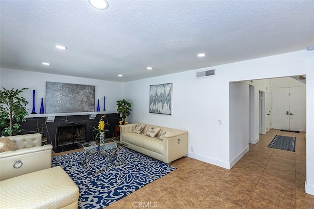 1250 Kinglake Dr, Diamond Bar, CA 91789 - living room featuring recessed lighting, a textured ceiling, and a fireplace with flush hearth
