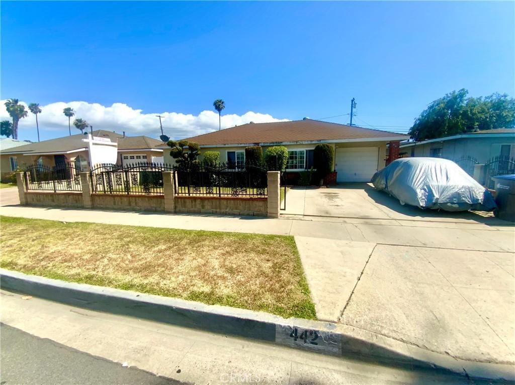442 E 181st St, Carson, CA 90746 - ranch-style home with a garage, a fenced front yard, and concrete driveway