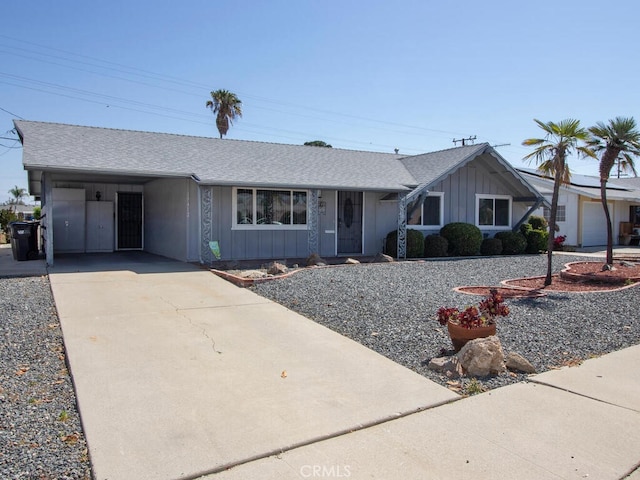 29412 Carmel Rd, Menifee, CA 92586 - single story home with board and batten siding, driveway, roof with shingles, and a carport