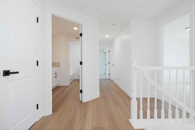 6871 Mewall Dr, San Diego, CA 92119 - corridor featuring light wood-type flooring, baseboards, and an upstairs landing