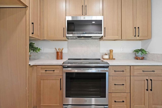 6871 Mewall Dr, San Diego, CA 92119 - kitchen with appliances with stainless steel finishes, light countertops, and light brown cabinets