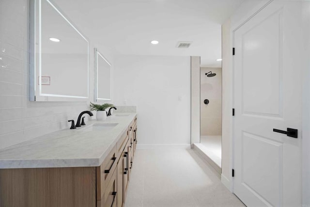 6871 Mewall Dr, San Diego, CA 92119 - bathroom with double vanity, a tile shower, baseboards, and recessed lighting
