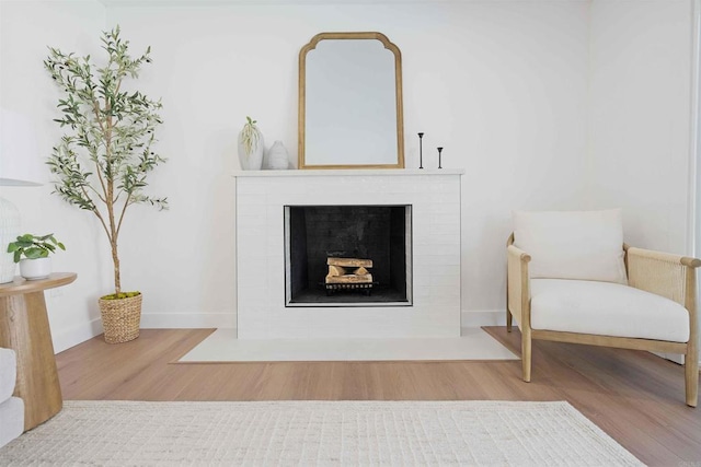 6871 Mewall Dr, San Diego, CA 92119 - detailed view of wood finished floors, a fireplace with flush hearth, and baseboards