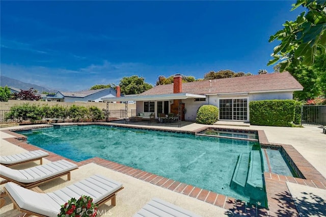 1919 Austin Ct, Claremont, CA 91711 - view of swimming pool featuring a patio area, a fenced backyard, a pool with connected hot tub, and a diving board