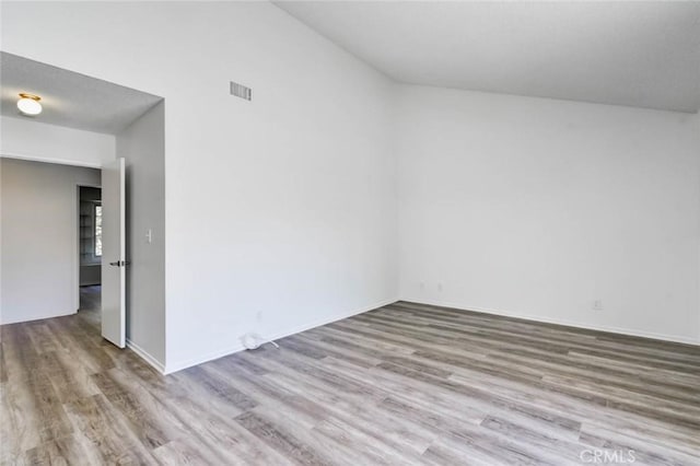 1919 Austin Ct, Claremont, CA 91711 - spare room with wood finished floors, lofted ceiling, and baseboards