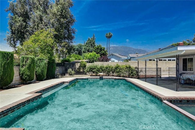1919 Austin Ct, Claremont, CA 91711 - view of pool with a patio, a fenced backyard, and a mountain view