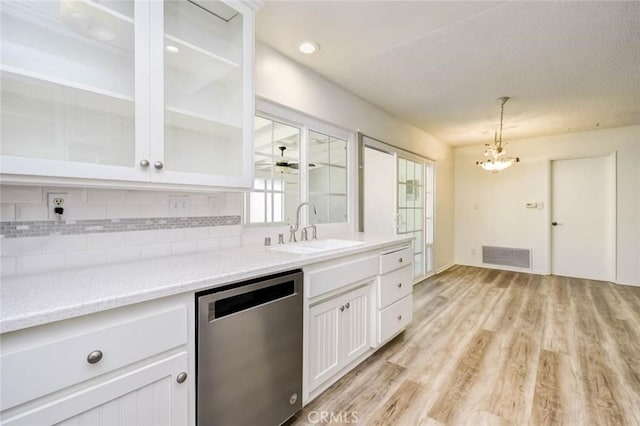 1919 Austin Ct, Claremont, CA 91711 - kitchen with stainless steel dishwasher, a sink, light wood-type flooring, backsplash, and a chandelier