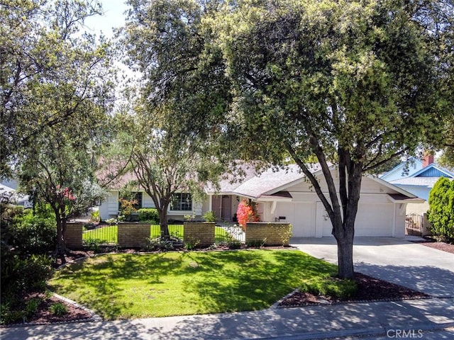 1919 Austin Ct, Claremont, CA 91711 - view of property hidden behind natural elements with driveway and an attached garage