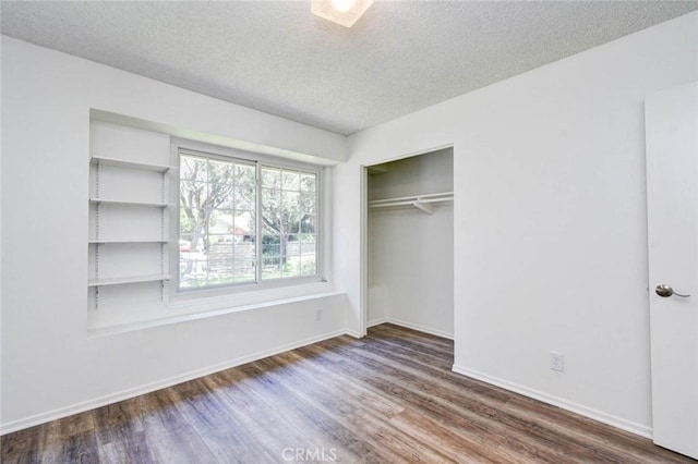 1919 Austin Ct, Claremont, CA 91711 - unfurnished bedroom featuring dark wood-style flooring, a textured ceiling, and baseboards