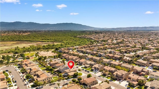 7626 Soaring Bird Ct, Eastvale, CA 92880 - aerial perspective of suburban area featuring a mountainous background