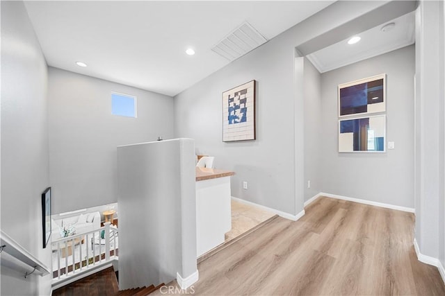 7626 Soaring Bird Ct, Eastvale, CA 92880 - hall featuring light wood-style flooring, recessed lighting, and baseboards