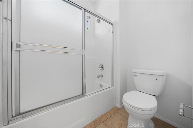 7626 Soaring Bird Ct, Eastvale, CA 92880 - full bath featuring baseboards, toilet, tile patterned flooring, and combined bath / shower with glass door