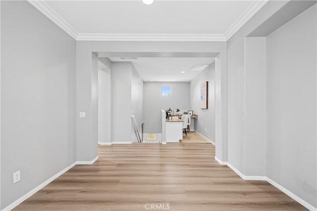 7626 Soaring Bird Ct, Eastvale, CA 92880 - hallway with light wood-style flooring, an upstairs landing, baseboards, and ornamental molding