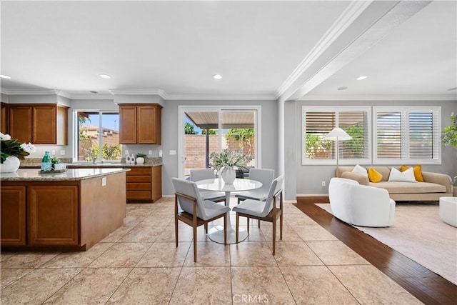 7626 Soaring Bird Ct, Eastvale, CA 92880 - dining space featuring plenty of natural light, ornamental molding, baseboards, and recessed lighting