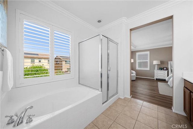 7626 Soaring Bird Ct, Eastvale, CA 92880 - ensuite bathroom with vanity, a bath, tile patterned flooring, a shower stall, and crown molding