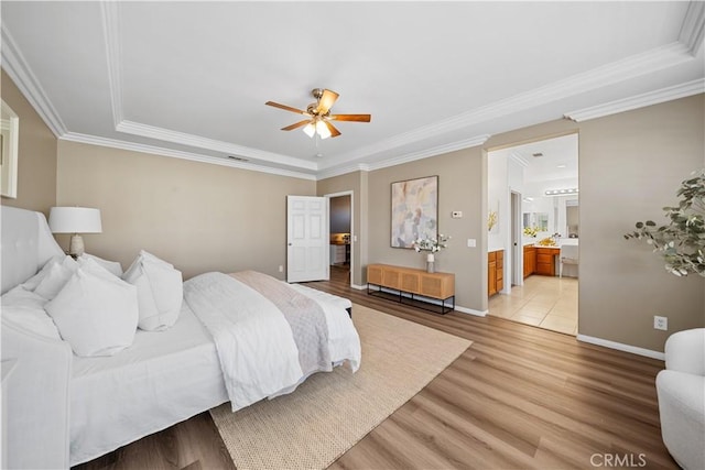 7626 Soaring Bird Ct, Eastvale, CA 92880 - bedroom featuring light wood-style flooring, baseboards, ornamental molding, connected bathroom, and a ceiling fan