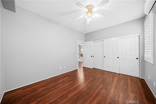 7626 Soaring Bird Ct, Eastvale, CA 92880 - unfurnished bedroom featuring a wall mounted air conditioner, wood finished floors, baseboards, a ceiling fan, and a closet