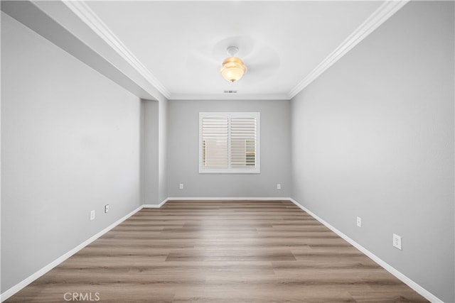 7626 Soaring Bird Ct, Eastvale, CA 92880 - spare room featuring crown molding, wood finished floors, and baseboards
