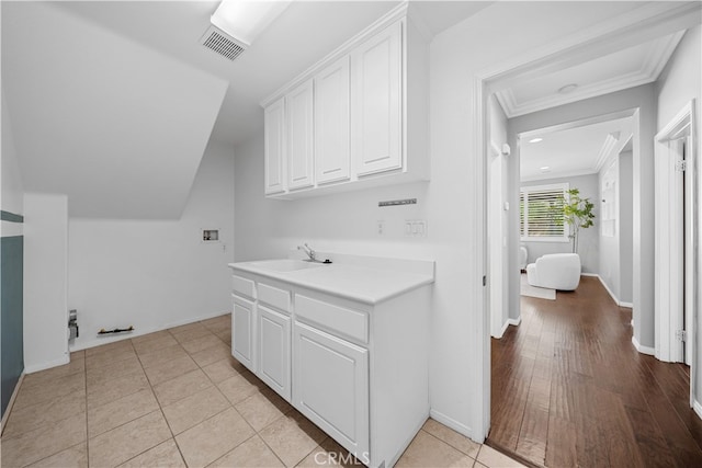 7626 Soaring Bird Ct, Eastvale, CA 92880 - laundry area with ornamental molding, washer hookup, and baseboards