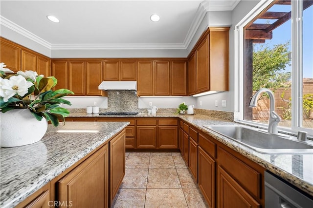 7626 Soaring Bird Ct, Eastvale, CA 92880 - kitchen featuring under cabinet range hood, a sink, black gas cooktop, brown cabinets, and stainless steel dishwasher
