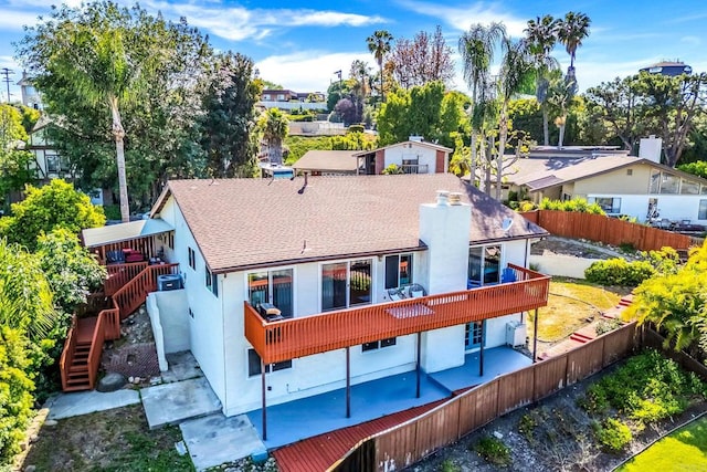 2548 Katherine Ct, El Cajon, CA 92020 - back of property featuring a fenced backyard, a patio, stairway, and stucco siding