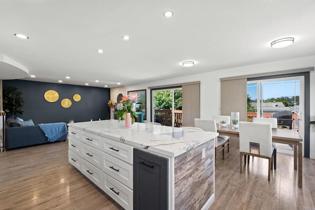 2548 Katherine Ct, El Cajon, CA 92020 - kitchen featuring white cabinets, recessed lighting, a center island, light wood-style flooring, and an accent wall