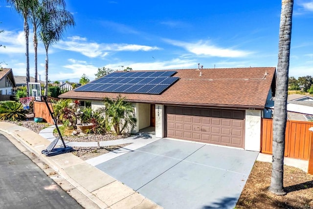 2548 Katherine Ct, El Cajon, CA 92020 - view of front of property featuring a shingled roof, an attached garage, driveway, and solar panels