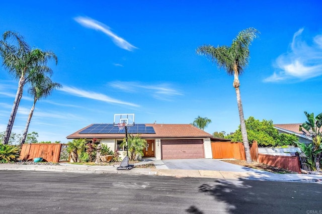 2548 Katherine Ct, El Cajon, CA 92020 - view of front of property featuring roof mounted solar panels, a garage, and driveway