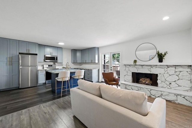 2548 Katherine Ct, El Cajon, CA 92020 - living area featuring dark wood-type flooring, a premium fireplace, and recessed lighting