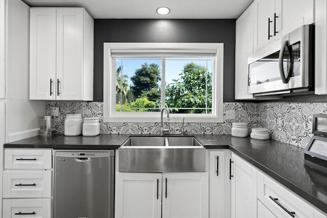 2548 Katherine Ct, El Cajon, CA 92020 - kitchen with stainless steel appliances, a sink, dark countertops, and plenty of natural light